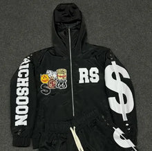 Load image into Gallery viewer, A black hooded zip-up jacket with white graphic text and illustrations, laid flat on a dark gray textured background. The jacket features 'RICHSOON' on the right sleeve, 'RS' on the left chest, and a large white dollar sign on the left sleeve.